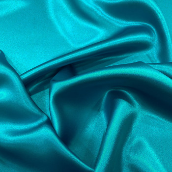 Turquoise blue satin-backed 100% silk crepe fabric