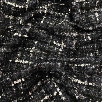 Woven and iridescent fabric with grey and white tweed effect